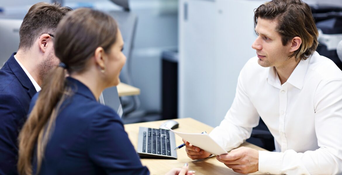 Adult couple in the office with real estate agent